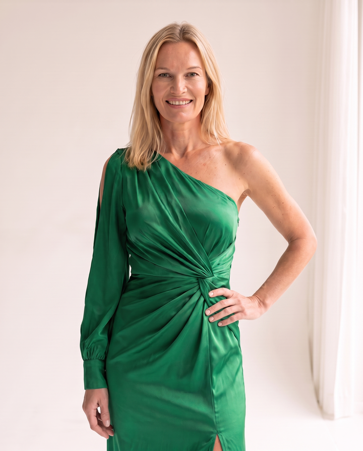 Woman wearing one shoulder satin evening dress