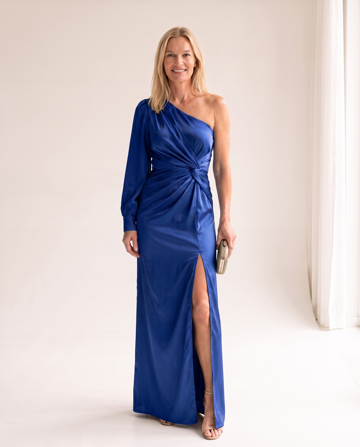 Woman wearing one shoulder satin evening dress