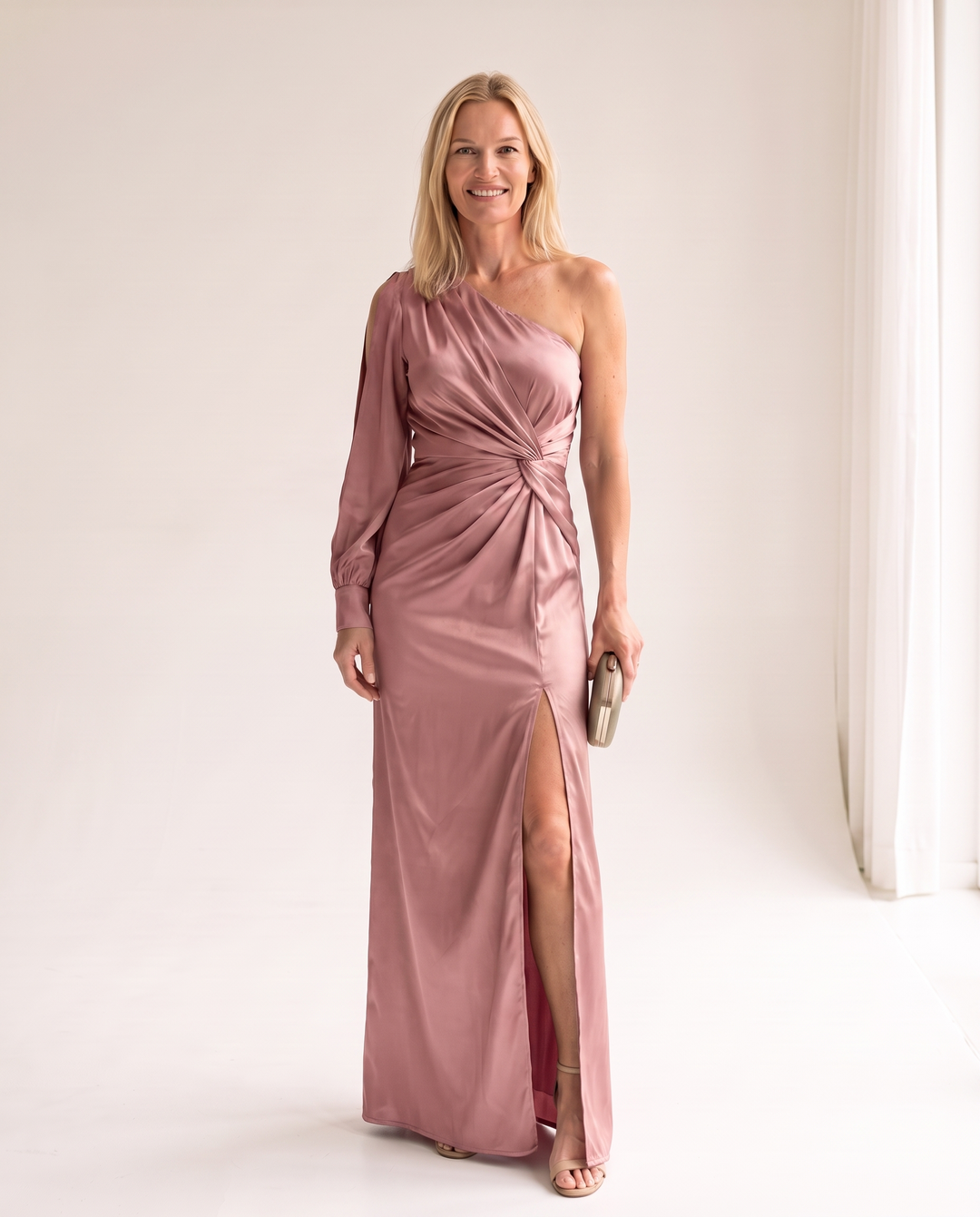 Woman wearing one shoulder satin evening dress