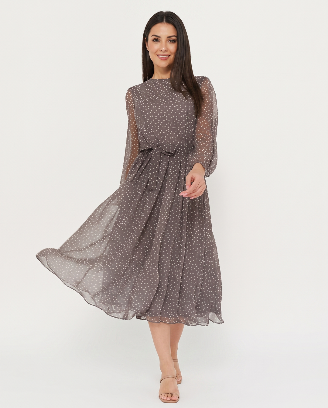 Woman wearing polka dot midi dress