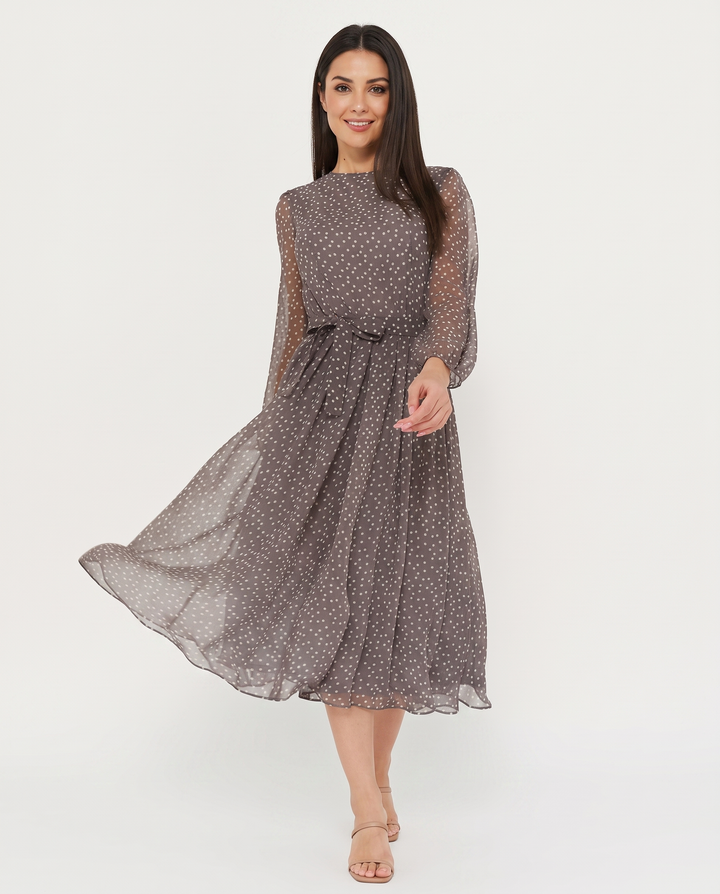 Woman wearing polka dot midi dress