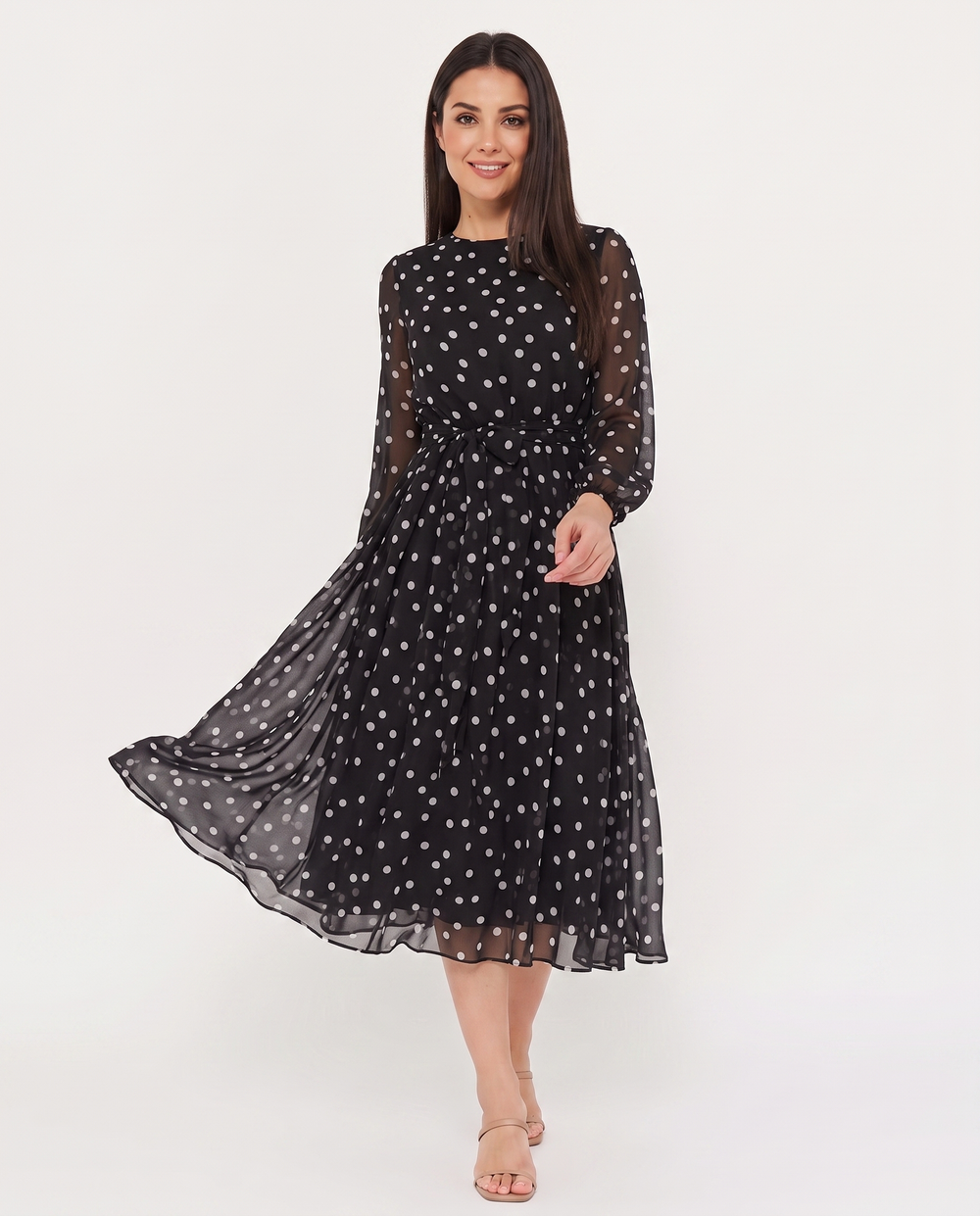 Woman wearing polka dot midi dress