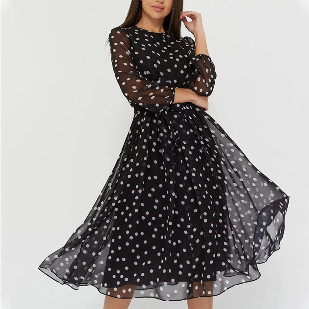 Woman wearing polka dot midi dress