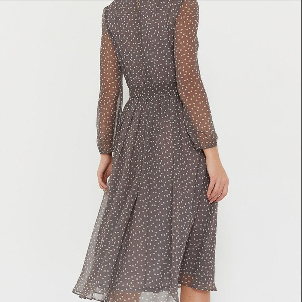 Woman wearing polka dot midi dress
