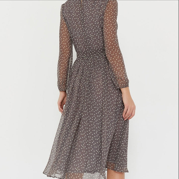 Woman wearing polka dot midi dress