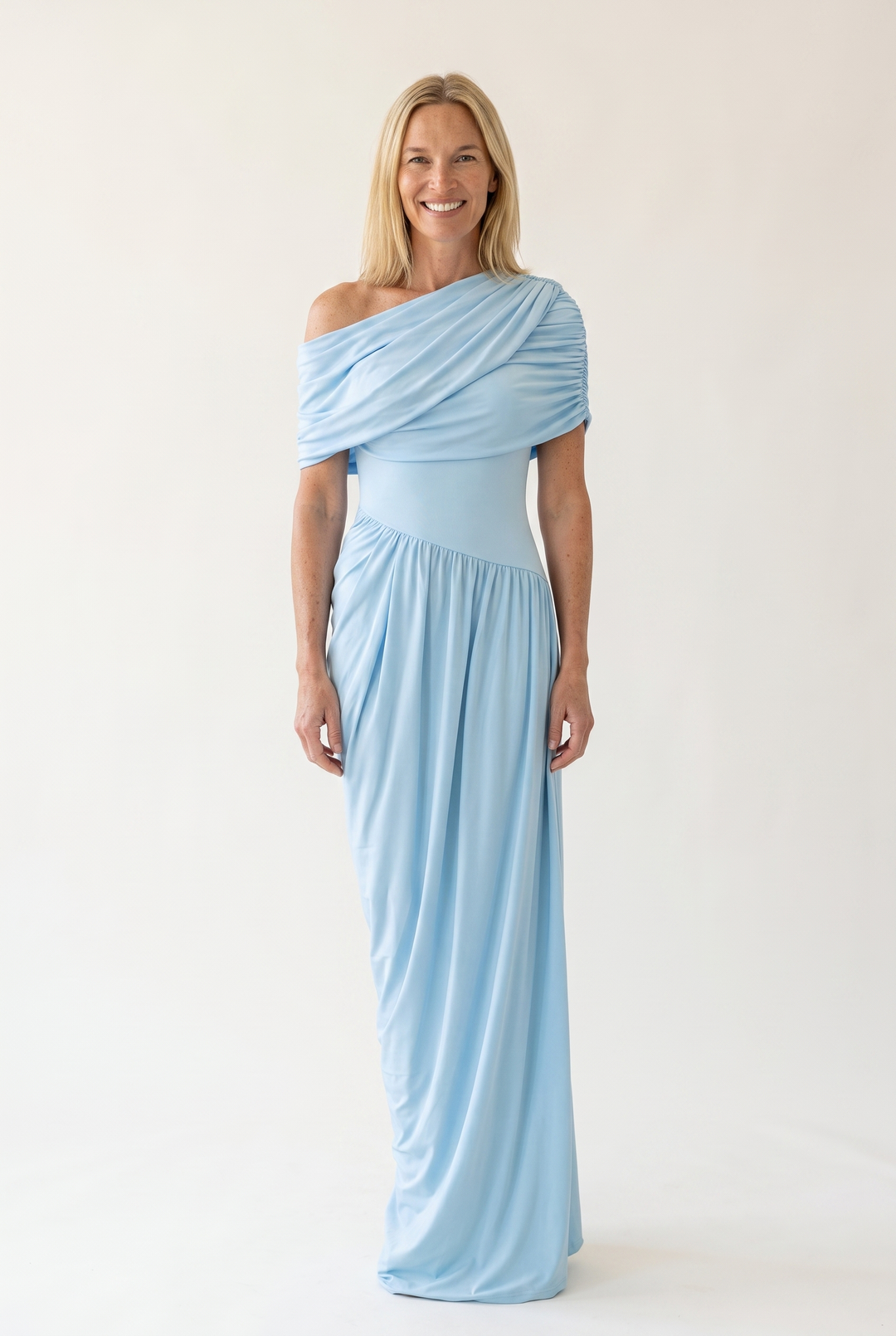 Woman wearing off shoulder maxi evening dress