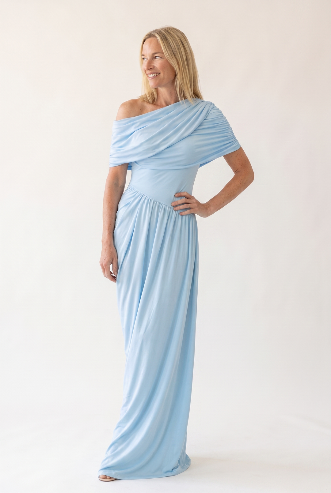 Woman wearing off shoulder maxi evening dress