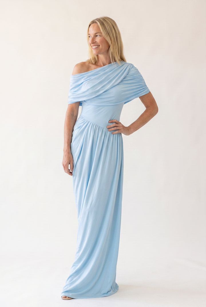 Woman wearing off shoulder maxi evening dress