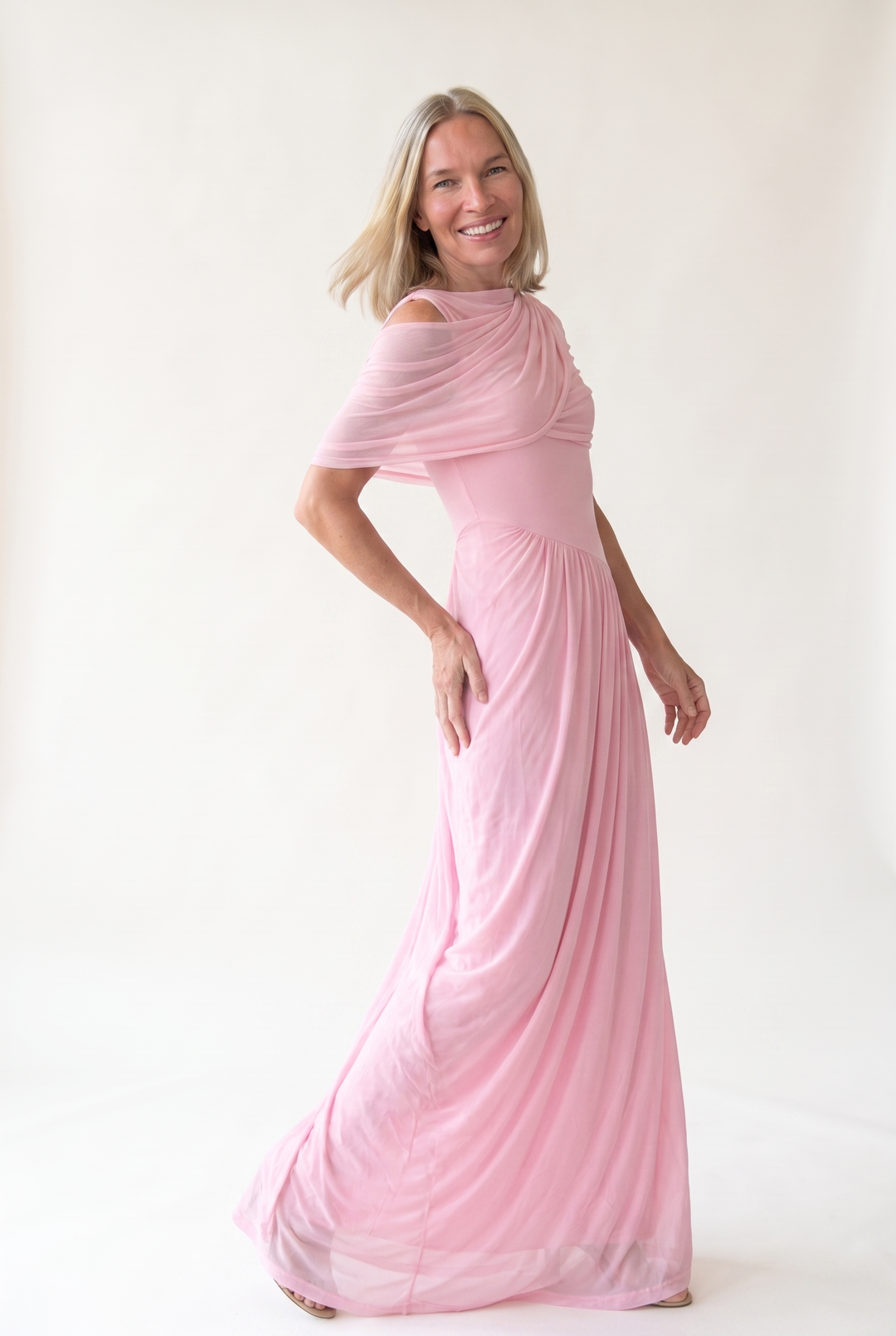 Woman wearing off shoulder maxi evening dress