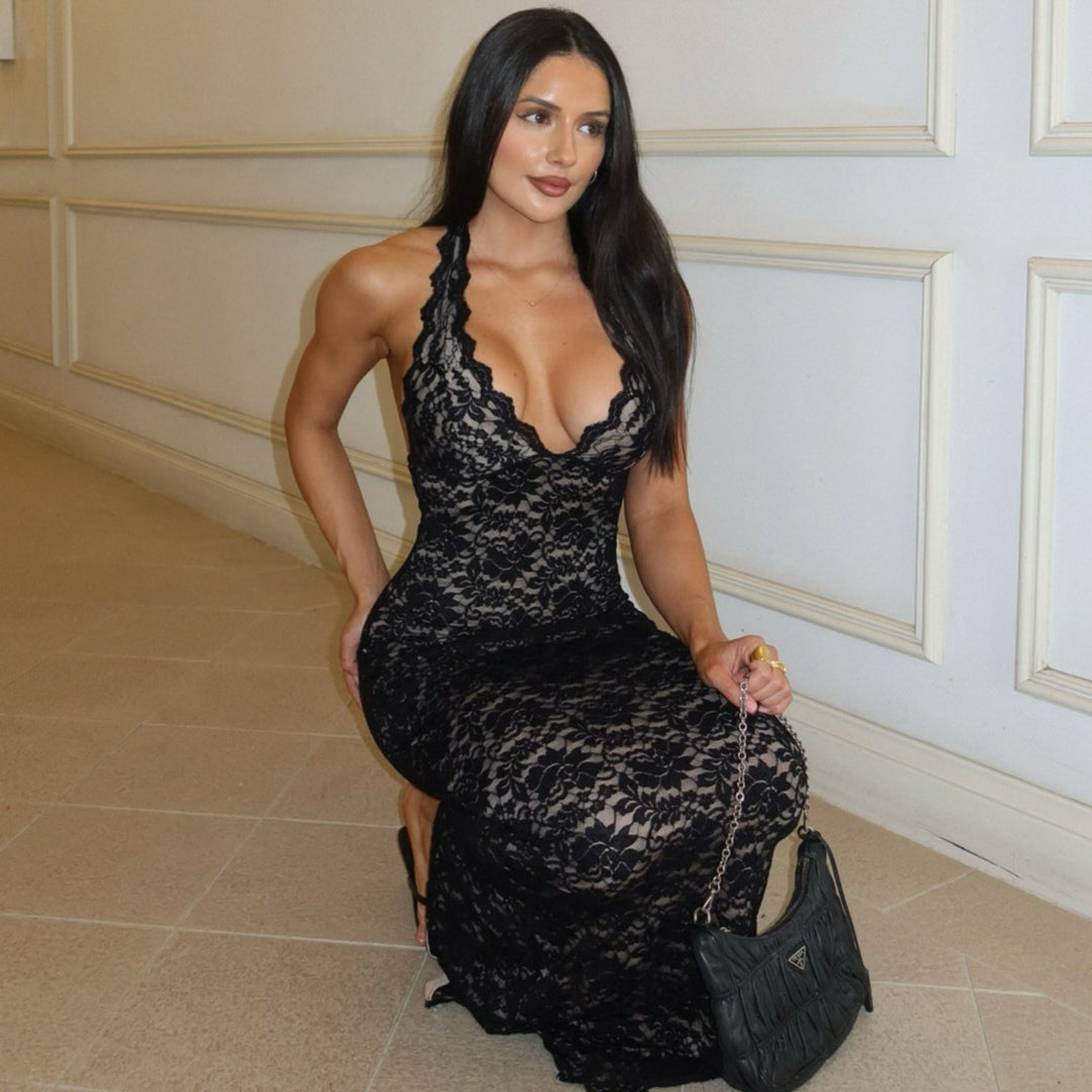 Woman wearing black lace halter backless maxi dress