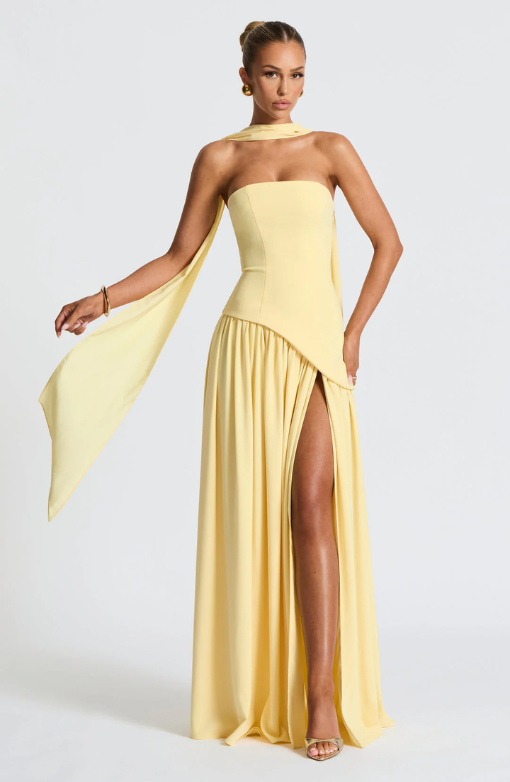 Woman wearing strapless split evening maxi dress