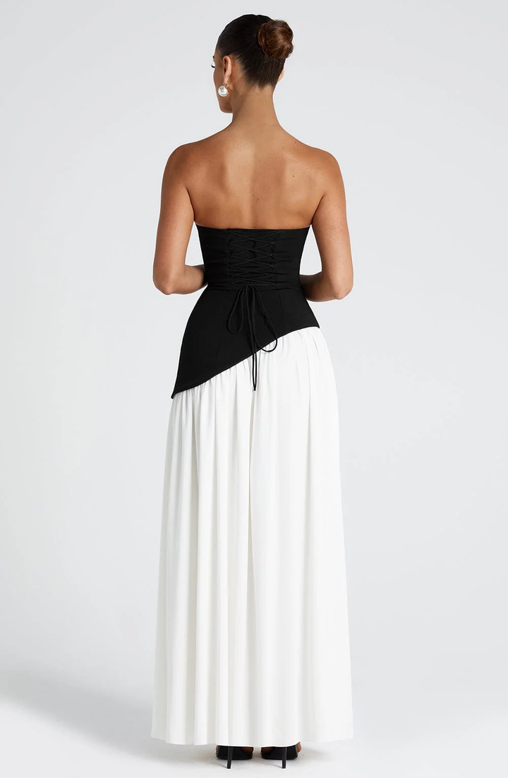 Woman wearing strapless split evening maxi dress