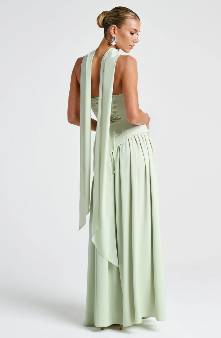 Woman wearing strapless split evening maxi dress