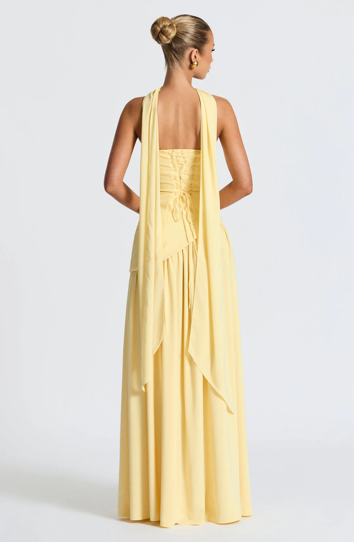 Woman wearing strapless split evening maxi dress