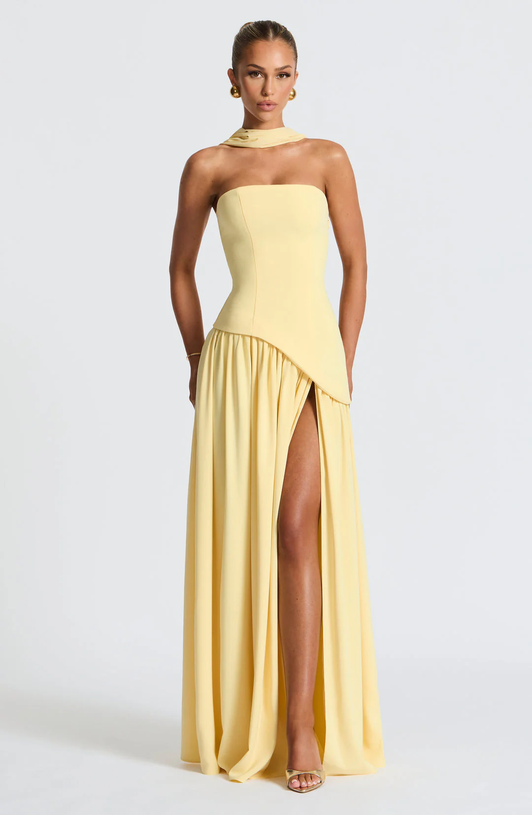 Woman wearing strapless split evening maxi dress