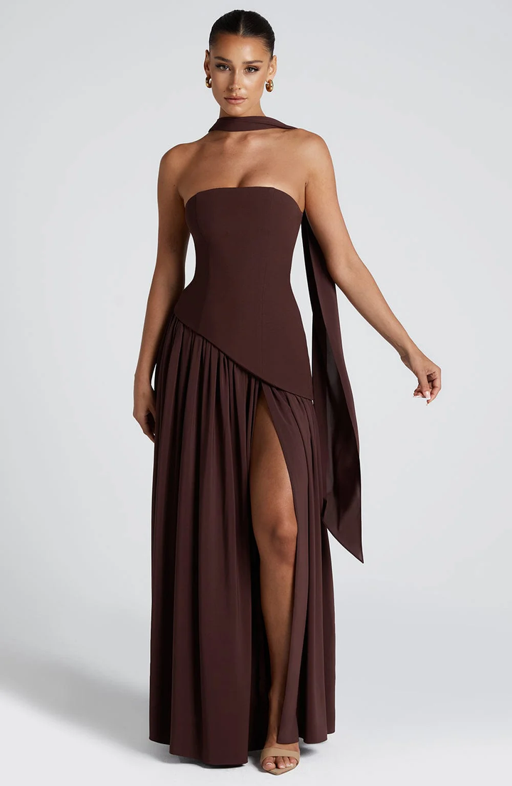 Woman wearing strapless split evening maxi dress