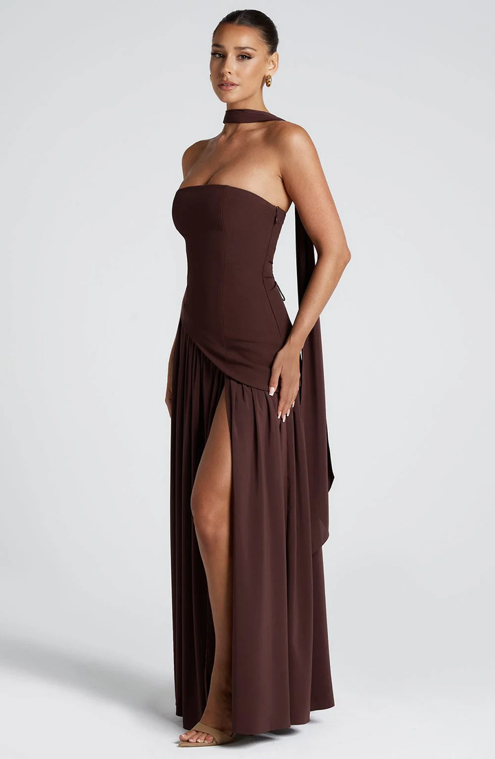 Woman wearing strapless split evening maxi dress