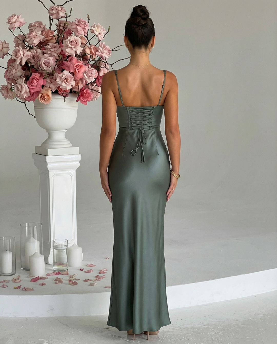 Woman wearing satin corset maxi dress
