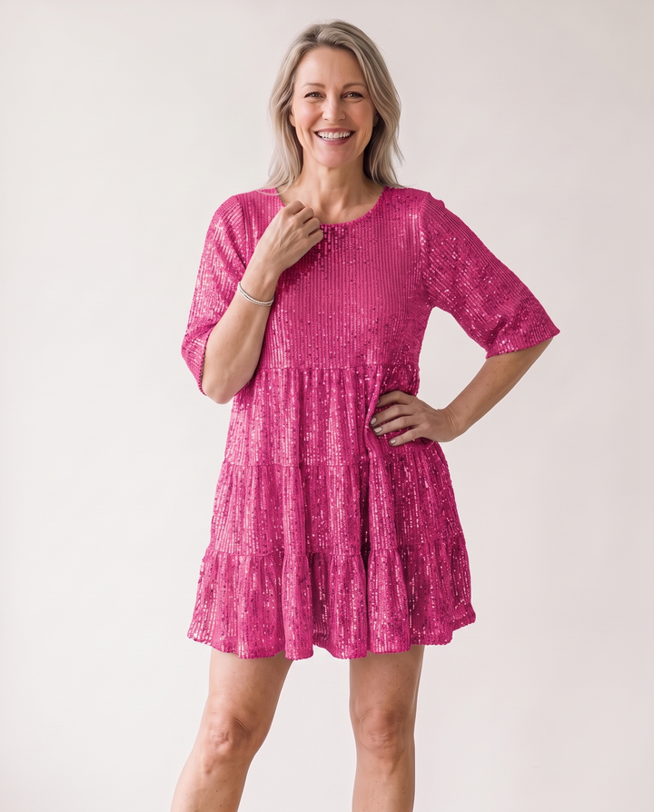 Woman wearing sequin oversized mini dress