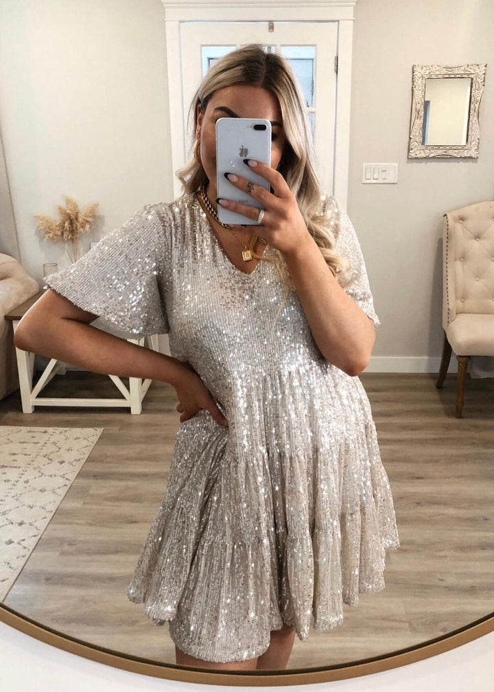 Woman wearing sequin oversized mini dress