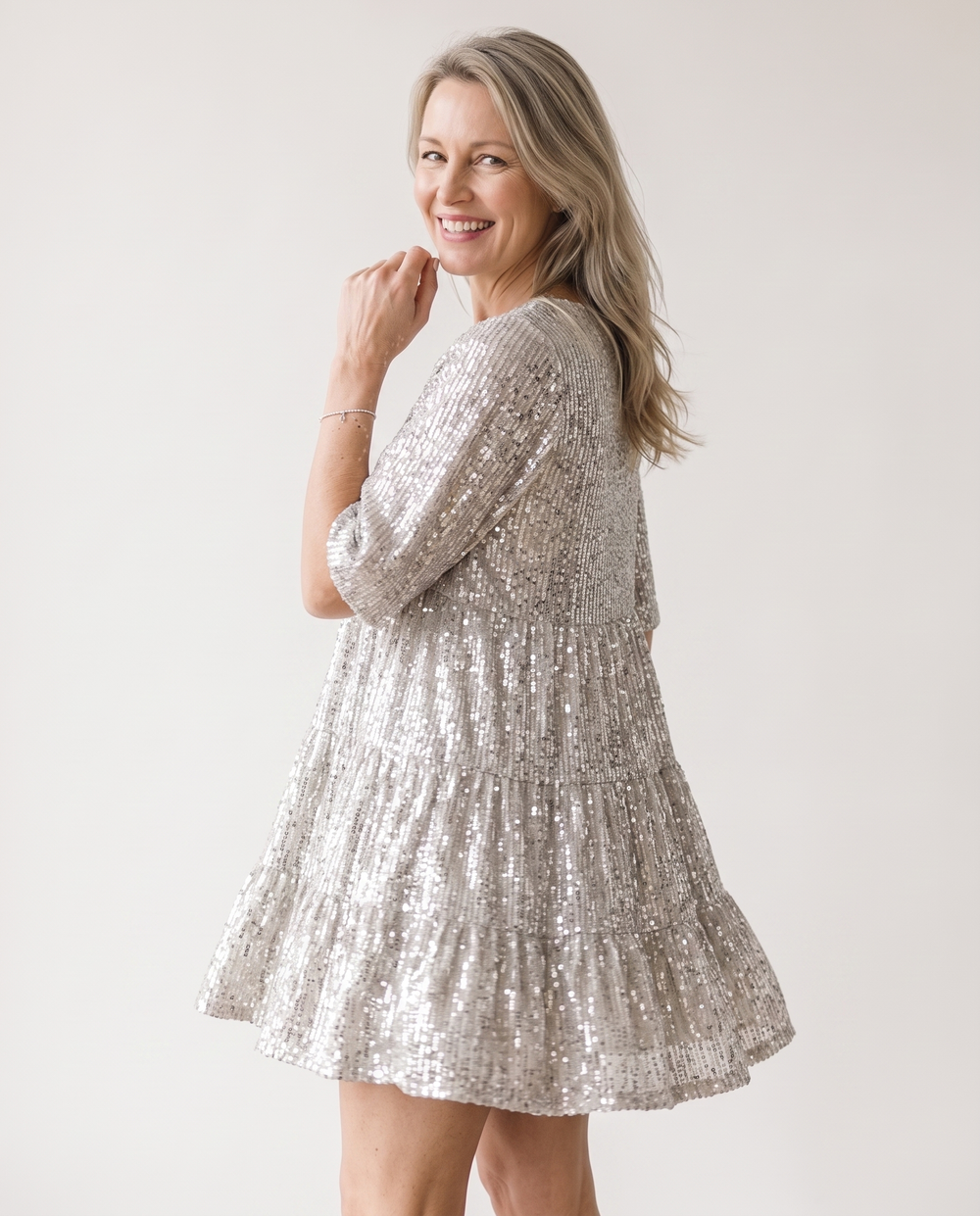 Woman wearing sequin oversized mini dress