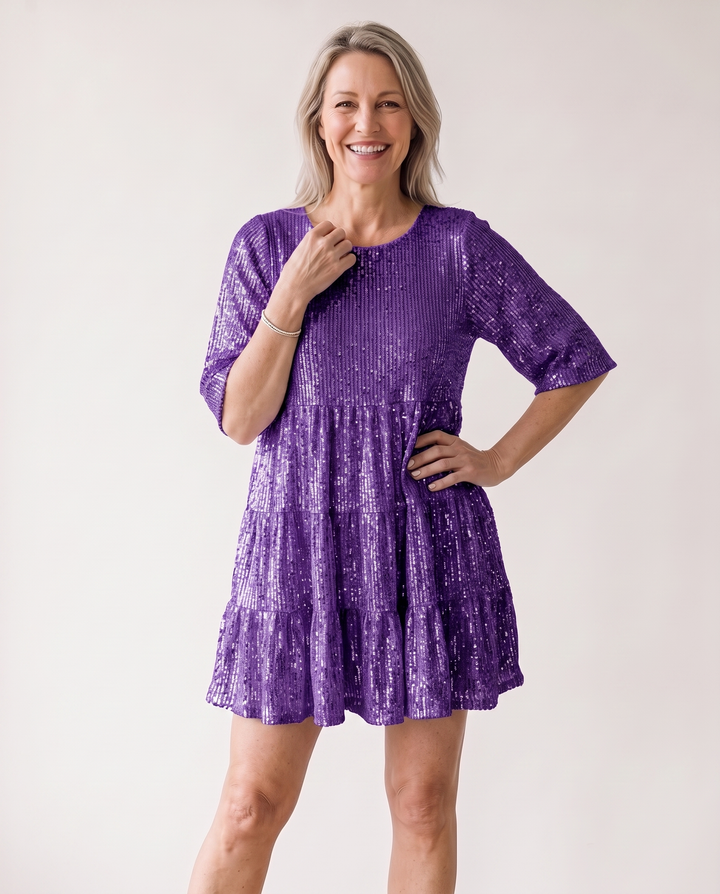 Woman wearing sequin oversized mini dress