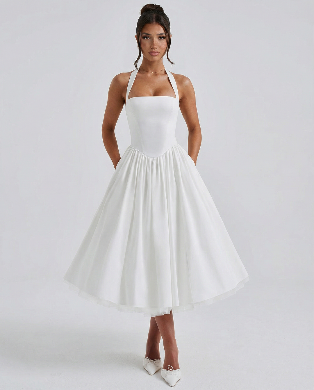 Woman wearing elegant white midi dress