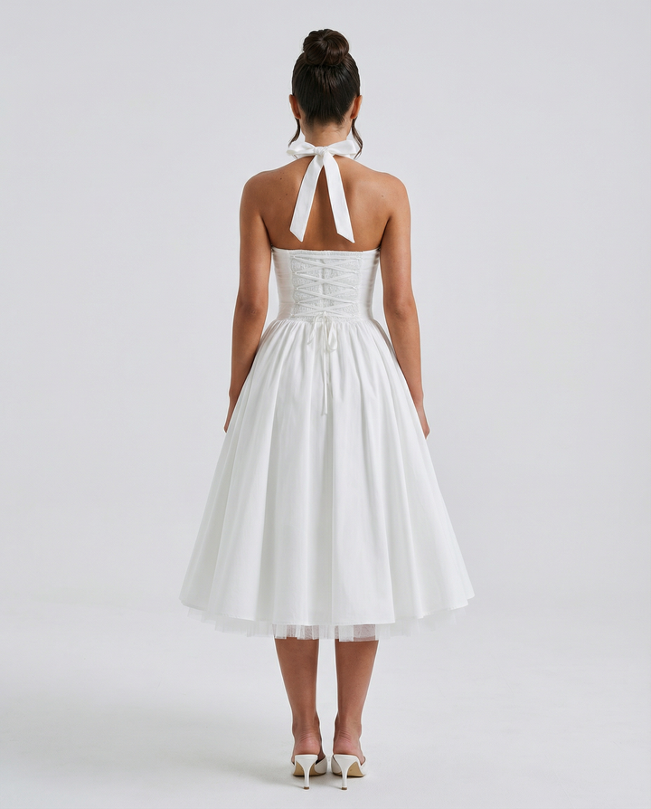 Woman wearing elegant white midi dress