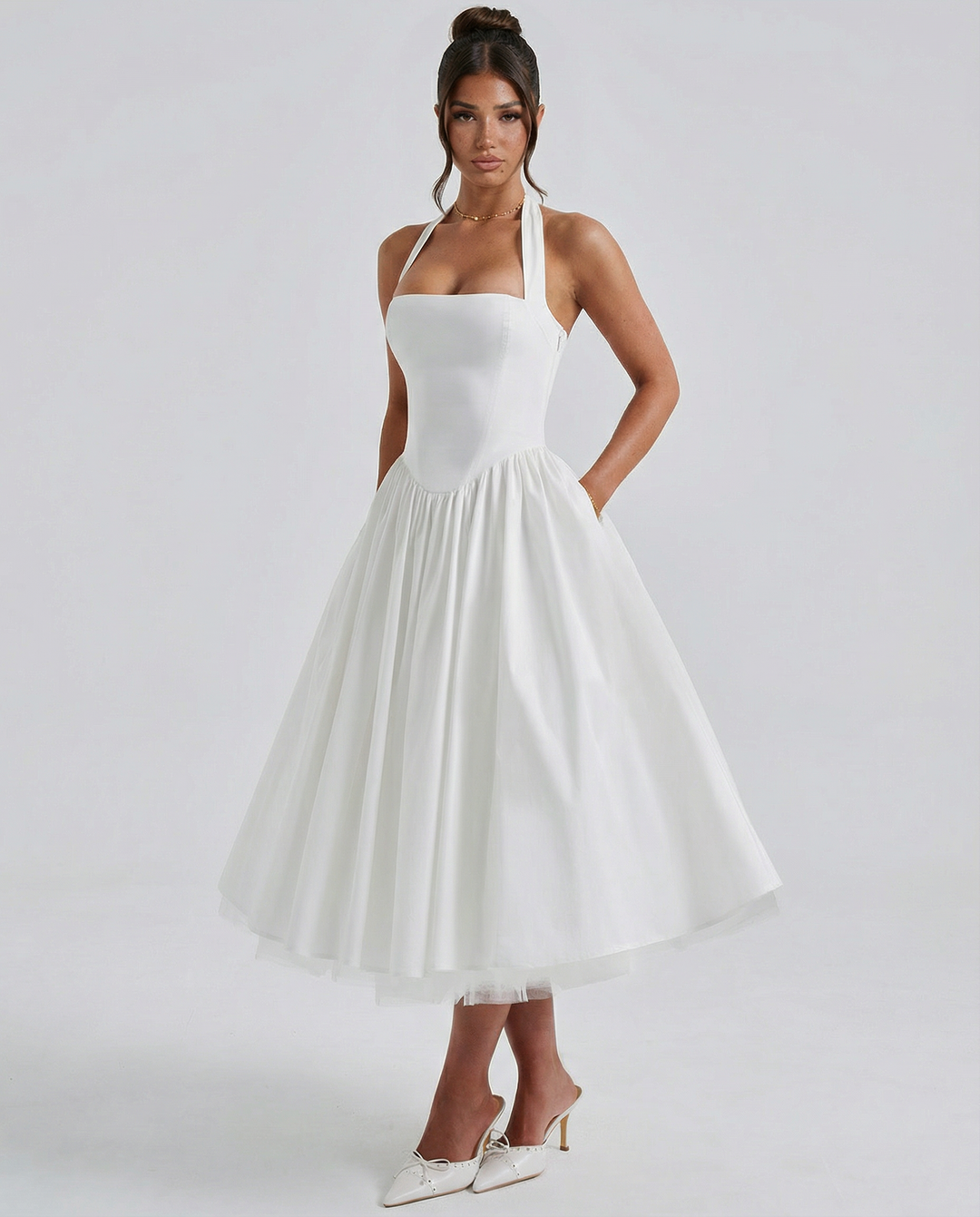 Woman wearing elegant white midi dress
