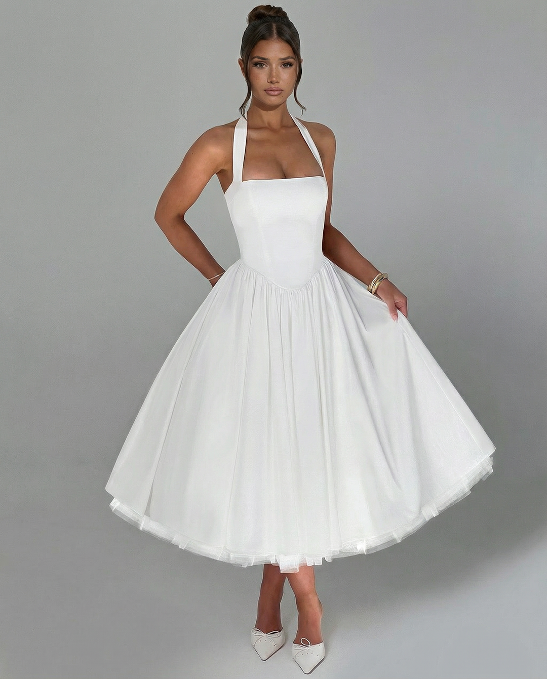 Woman wearing elegant white midi dress