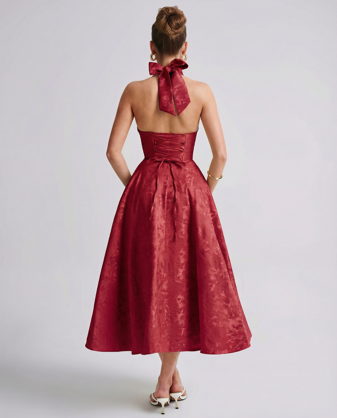 Woman wearing vintage halter midi dress