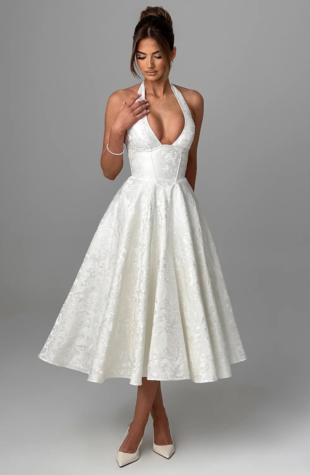 Woman wearing vintage halter midi dress