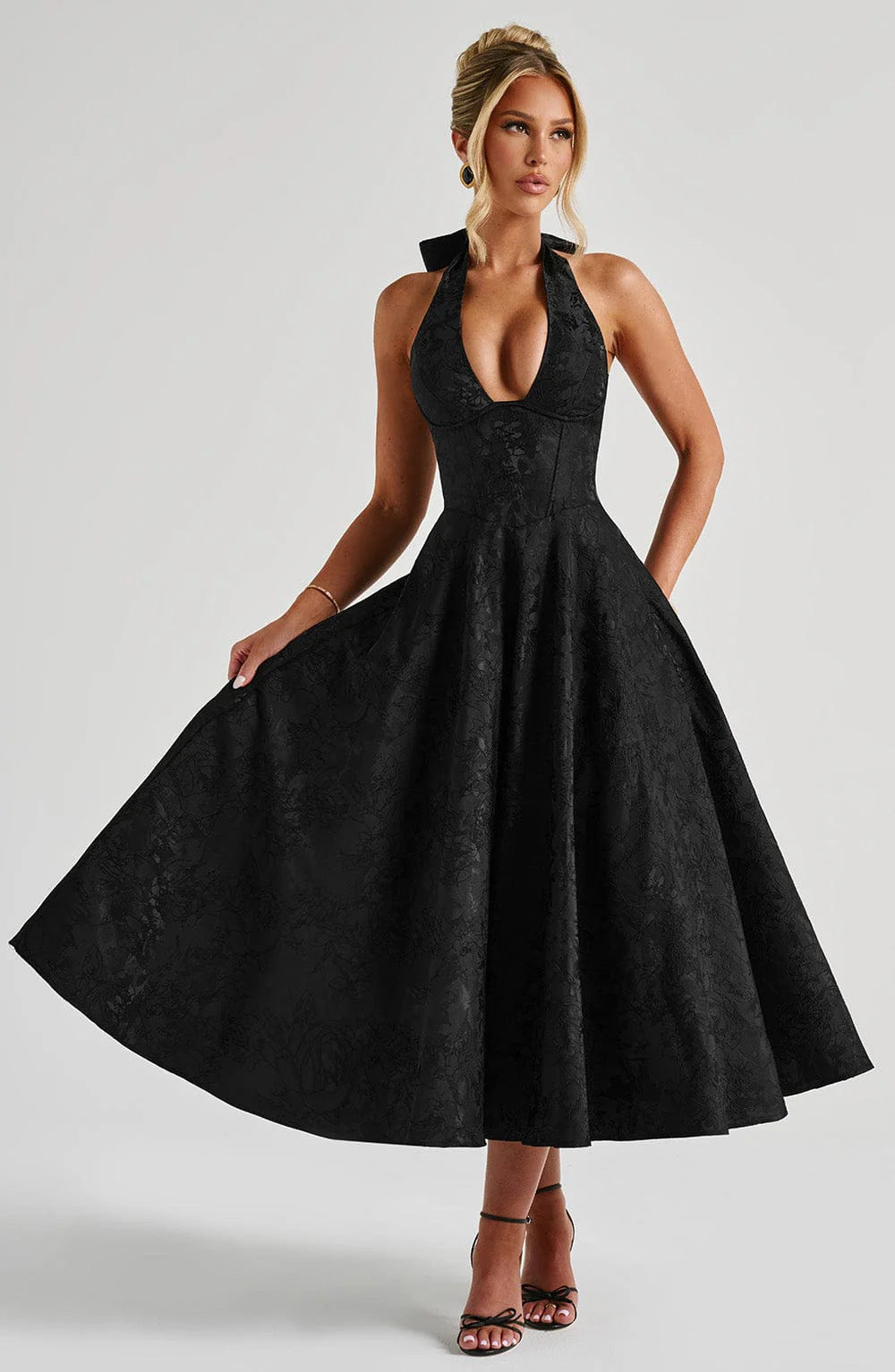 Woman wearing vintage halter midi dress
