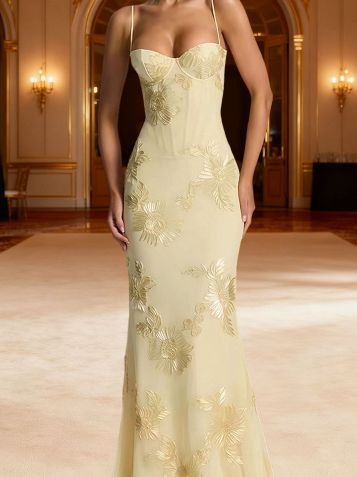 Woman wearing embroidered mermaid maxi dress