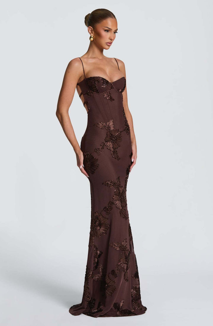Woman wearing embroidered mermaid maxi dress