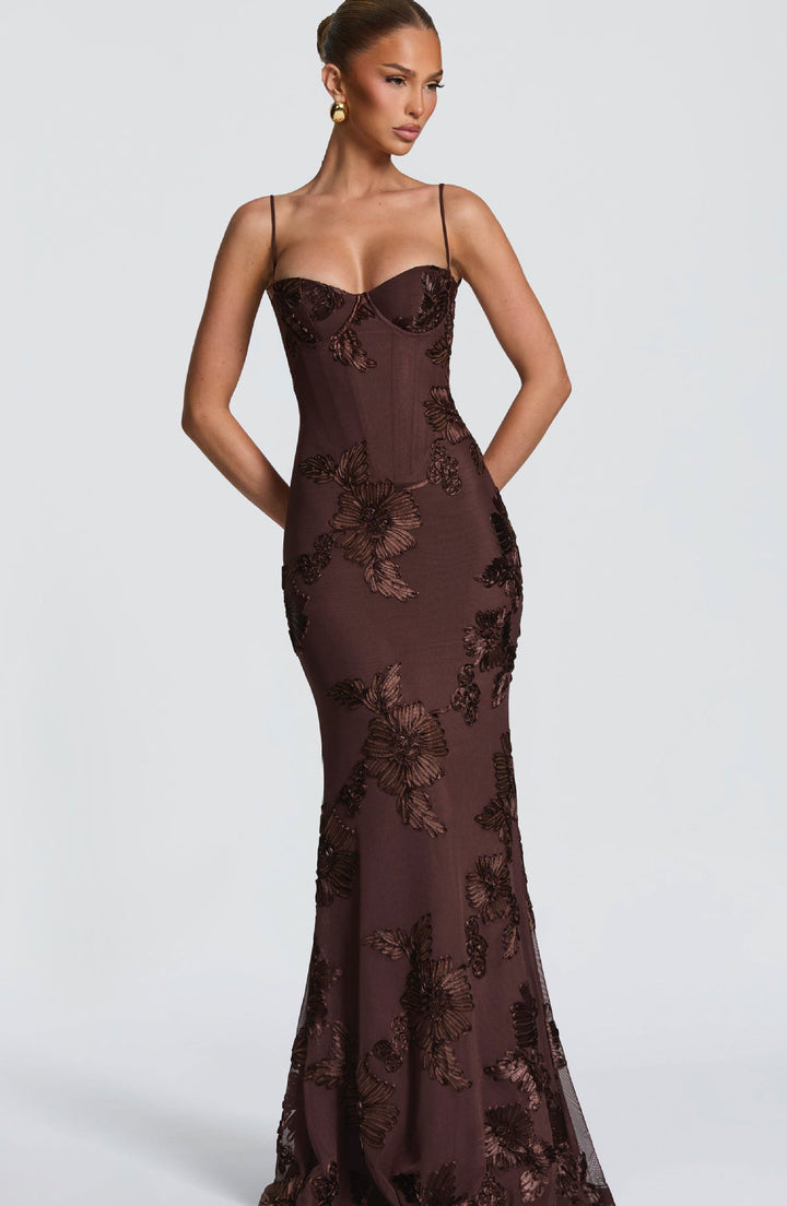 Woman wearing embroidered mermaid maxi dress