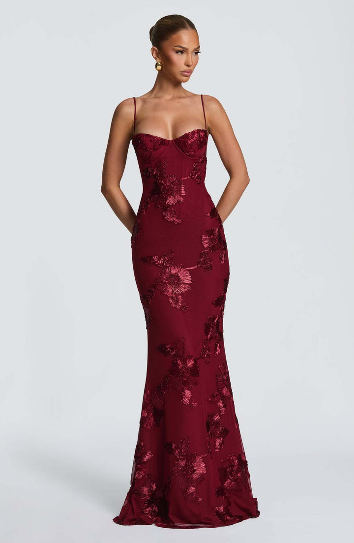 Woman wearing embroidered mermaid maxi dress
