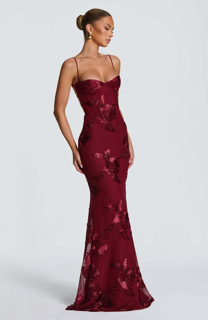 Woman wearing embroidered mermaid maxi dress
