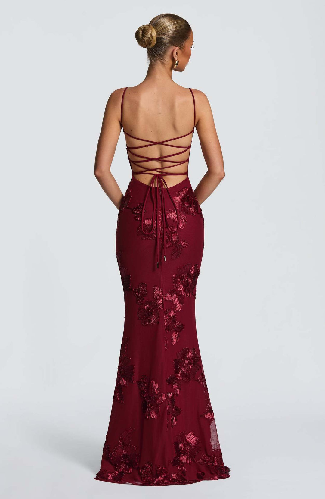 Woman wearing embroidered mermaid maxi dress