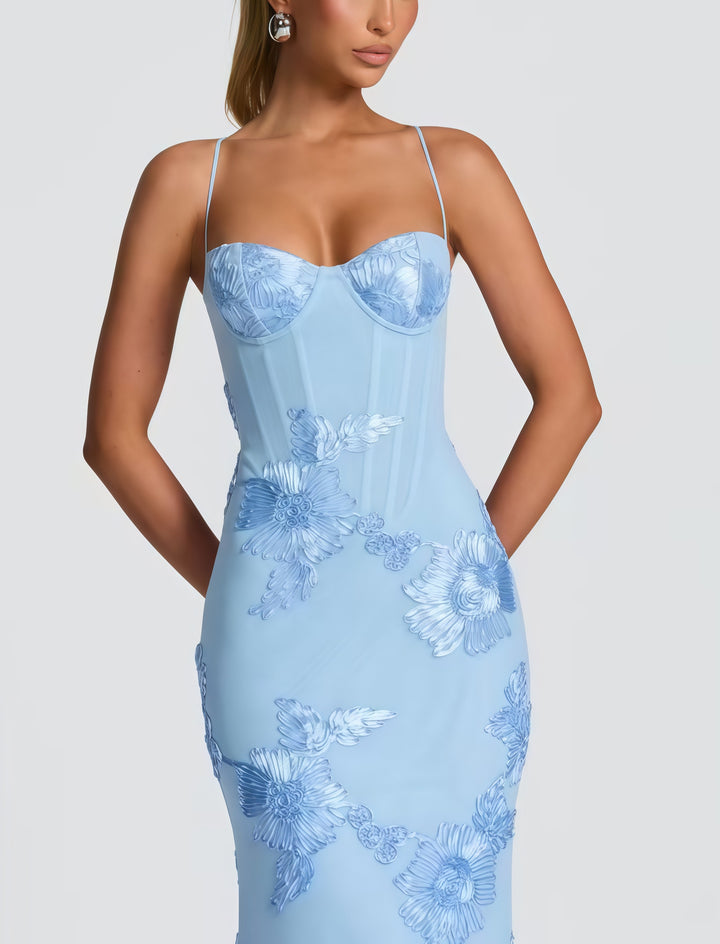 Woman wearing embroidered mermaid maxi dress