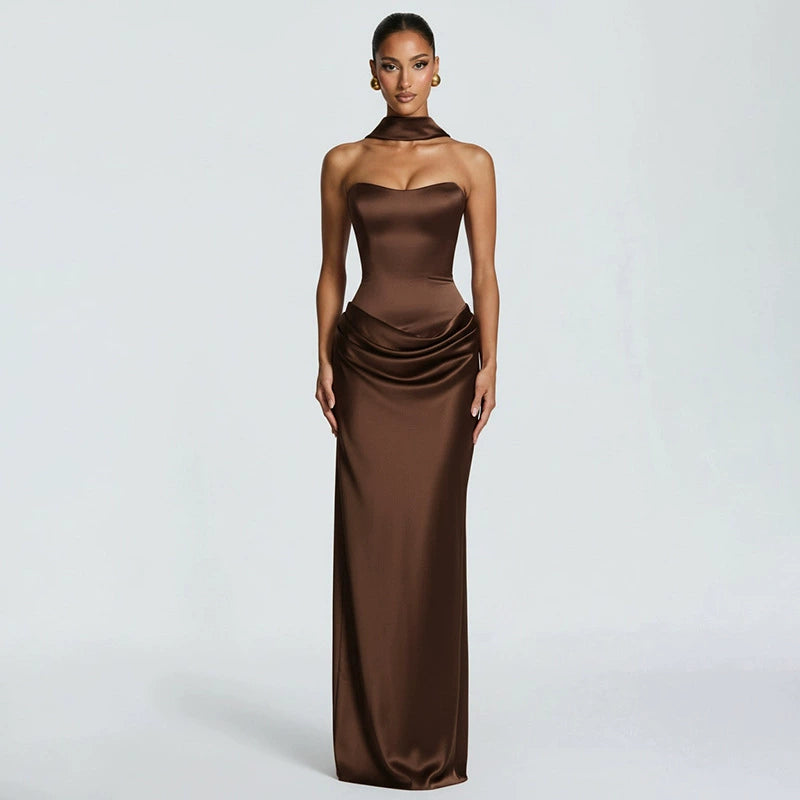 Woman wearing black satin corset maxi dress