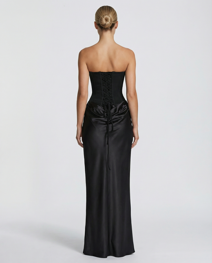 Woman wearing black satin corset maxi dress