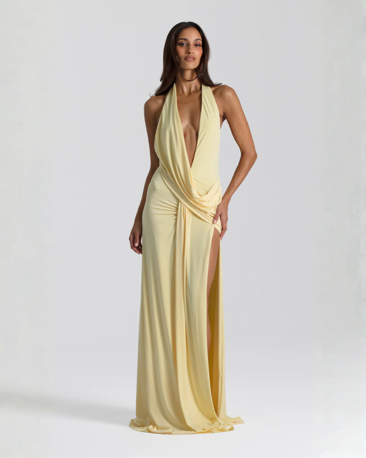 Woman wearing backless satin evening maxi dress