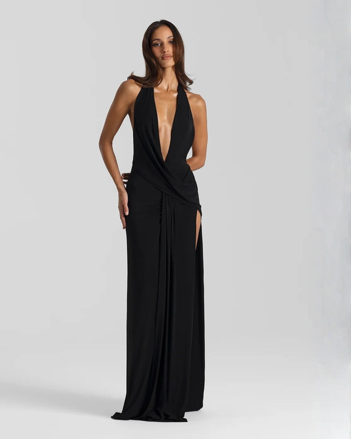 Woman wearing backless satin evening maxi dress