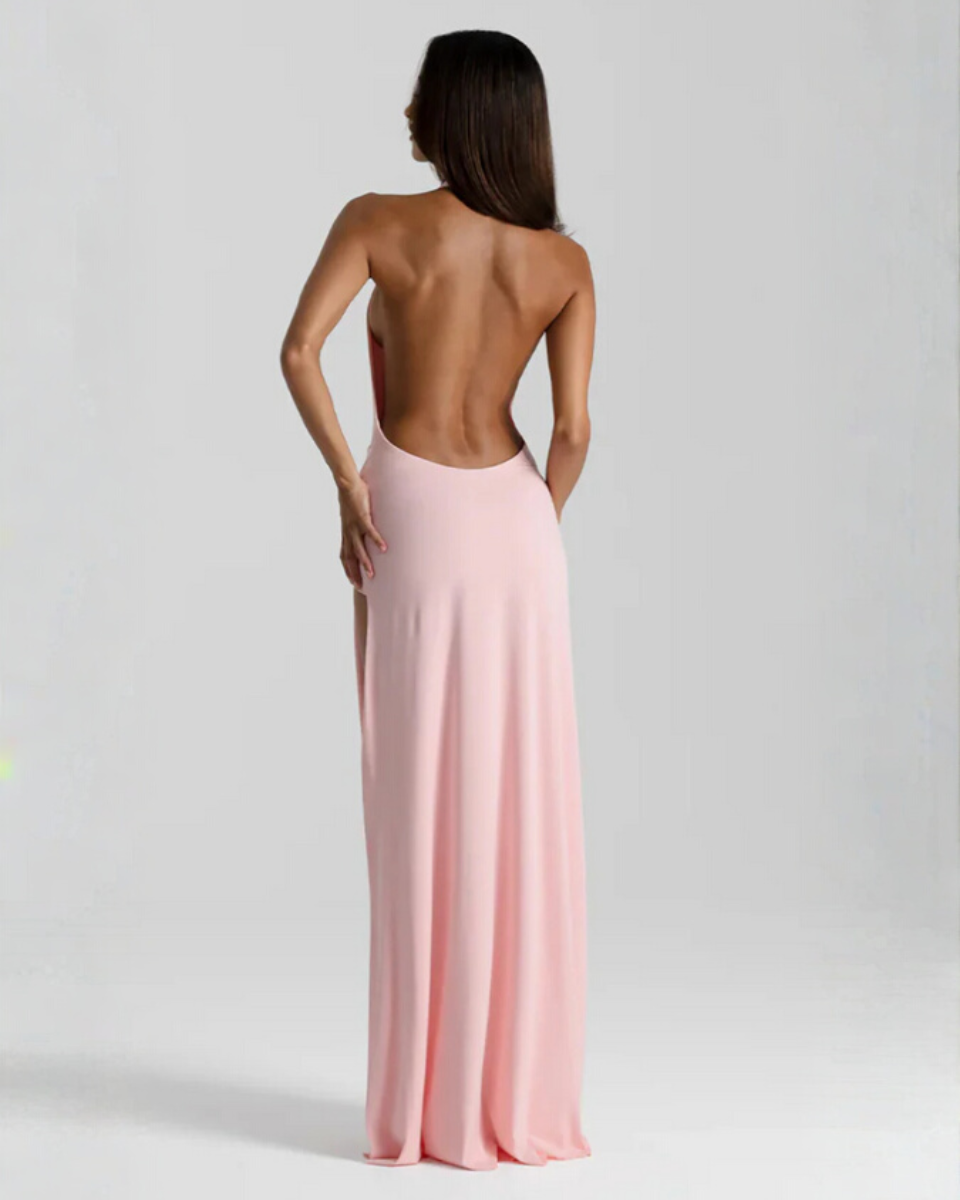 Woman wearing backless satin evening maxi dress