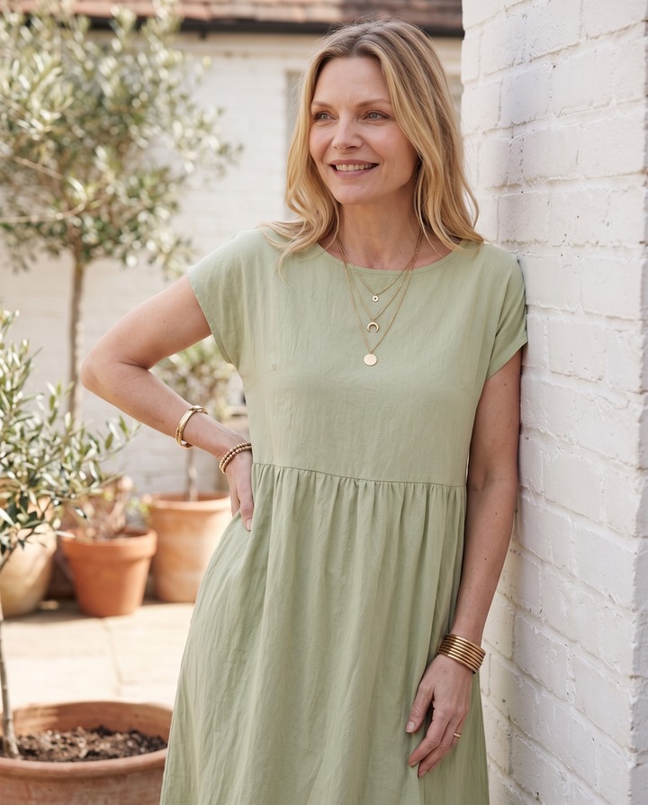 Woman wearing effortless linen midi dress