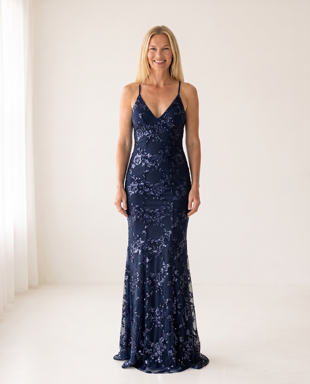 Woman wearing sequin mermaid maxi dress
