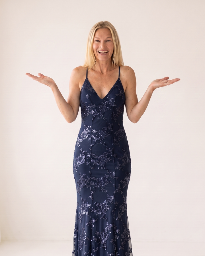 Woman wearing sequin mermaid maxi dress
