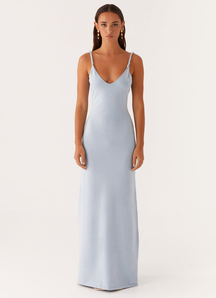 Woman wearing soft blue maxi dress
