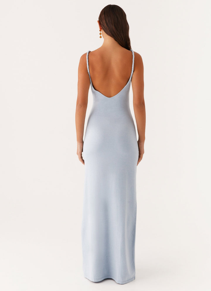 Woman wearing soft blue maxi dress